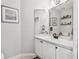 Small bathroom with updated vanity, corner sink and toilet at 372 Hinsdale Dr, Debary, FL 32713