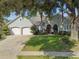Two-story house with double garage and manicured lawn at 372 Hinsdale Dr, Debary, FL 32713