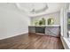 Gathering room with hardwood floors and barn door feature at 372 Hinsdale Dr, Debary, FL 32713