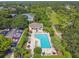 Community pool with adjacent clubhouse and parking at 372 Hinsdale Dr, Debary, FL 32713