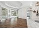 Open living room with wood-look flooring and access to pool area at 372 Hinsdale Dr, Debary, FL 32713
