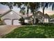Two-story house with double garage and manicured lawn at 372 Hinsdale Dr, Debary, FL 32713