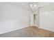 Cozy bedroom with carpeted floors, ceiling fan, and access to a bathroom at 372 Hinsdale Dr, Debary, FL 32713