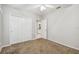 Comfortable bedroom with carpeted floors, ceiling fan, and access to bathroom at 372 Hinsdale Dr, Debary, FL 32713
