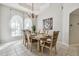 Dining room with a large picture, chandelier, and six chairs at 372 Hinsdale Dr, Debary, FL 32713