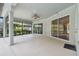 Spacious covered patio with sliding glass doors and ceiling fan at 372 Hinsdale Dr, Debary, FL 32713