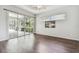 Bedroom with sliding glass doors leading to a patio and hardwood floors at 372 Hinsdale Dr, Debary, FL 32713
