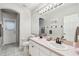 Bathroom with double vanity, updated fixtures and a separate shower at 372 Hinsdale Dr, Debary, FL 32713