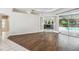 Bright Gathering room with pool view, hardwood floors, and sliding doors at 372 Hinsdale Dr, Debary, FL 32713