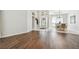Spacious living area with wood-look flooring and access to other rooms at 372 Hinsdale Dr, Debary, FL 32713