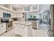 Open concept kitchen with island, stainless steel appliances and white cabinets at 372 Hinsdale Dr, Debary, FL 32713