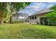 Spacious backyard with lush landscaping and pool at 372 Hinsdale Dr, Debary, FL 32713