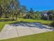 Outdoor basketball court with surrounding trees and landscaping at 372 Hinsdale Dr, Debary, FL 32713