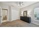 Bright bedroom with double closets, dresser, and ceiling fan at 372 Hinsdale Dr, Debary, FL 32713