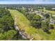 Aerial view of golf course with homes and lush green landscape at 372 Hinsdale Dr, Debary, FL 32713