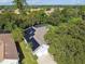 Aerial view showcasing the house, solar panels, and surrounding landscape at 372 Hinsdale Dr, Debary, FL 32713