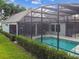 Home with solar panels and a screened-in pool at 372 Hinsdale Dr, Debary, FL 32713