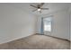 Bedroom with carpet, window, and ceiling fan at 2049 N Grandview St, Mount Dora, FL 32757