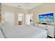 Bright bedroom with king bed and en-suite bathroom access at 453 Ocean Course Ave, Champions Gate, FL 33896