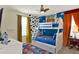 Fun Toy Story-themed bedroom with bunk beds and playful decor at 453 Ocean Course Ave, Champions Gate, FL 33896