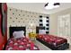 Bright Mickey Mouse-themed bedroom with twin beds and playful decor at 453 Ocean Course Ave, Champions Gate, FL 33896