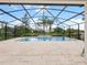 Inviting screened-in pool with a fountain and lake view at 11826 Aurelio Ln, Orlando, FL 32827