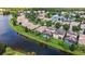 Aerial view of lakefront homes with private pools and lush landscaping at 11826 Aurelio Ln, Orlando, FL 32827