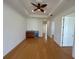Bright bonus room with hardwood floors, wet bar, and ceiling fan at 7465 Excitement Dr, Reunion, FL 34747