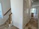 Bright entryway with tile flooring, staircase, and doors leading to other rooms at 7465 Excitement Dr, Reunion, FL 34747