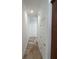 Bright hallway with tile flooring and two doors at 7465 Excitement Dr, Reunion, FL 34747