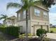 Two-story house with attached two car garage at 7465 Excitement Dr, Reunion, FL 34747