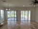 Bright dining area with tile floors and access to a patio at 7465 Excitement Dr, Reunion, FL 34747