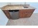 Wet bar with granite countertop and mini-fridge at 7465 Excitement Dr, Reunion, FL 34747