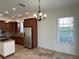 Eat-in kitchen with stainless steel appliances and granite countertops at 7465 Excitement Dr, Reunion, FL 34747