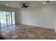 Open kitchen with island, stainless steel appliances, and wood cabinets at 7465 Excitement Dr, Reunion, FL 34747