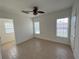 Bright bedroom featuring tile floors and ceiling fan at 7465 Excitement Dr, Reunion, FL 34747