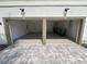 Two-car garage with epoxy floor and ample space for storage at 7465 Excitement Dr, Reunion, FL 34747