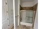 Bathroom with shower, shelving and tiled floor at 7465 Excitement Dr, Reunion, FL 34747