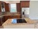 Kitchen island with granite countertop and electric cooktop at 7465 Excitement Dr, Reunion, FL 34747