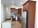 Modern kitchen with stainless steel appliances and granite countertops at 7465 Excitement Dr, Reunion, FL 34747