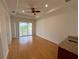 Bright living room with hardwood floors and sliding doors at 7465 Excitement Dr, Reunion, FL 34747