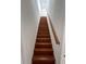 Modern wooden staircase with simple design at 7465 Excitement Dr, Reunion, FL 34747