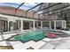 Resort-style pool with covered patio and lush landscaping at 256 New Gate Loop, Lake Mary, FL 32746