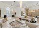 Living room with circular seating and formal dining area at 256 New Gate Loop, Lake Mary, FL 32746