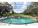 Inviting screened pool with spa and tranquil backyard views at 256 New Gate Loop, Lake Mary, FL 32746