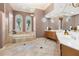 Large bathroom with soaking tub and double vanity at 256 New Gate Loop, Lake Mary, FL 32746