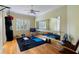 Well-equipped home gym with mirrored wall, exercise equipment, and hardwood floors at 256 New Gate Loop, Lake Mary, FL 32746
