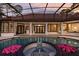 Luxury pool and spa with screened enclosure, view of home at 256 New Gate Loop, Lake Mary, FL 32746