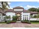 Stunning curb appeal with tile roof, landscaping, and brick walkway at 256 New Gate Loop, Lake Mary, FL 32746
