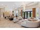Living area with curved sectional and pool view at 256 New Gate Loop, Lake Mary, FL 32746